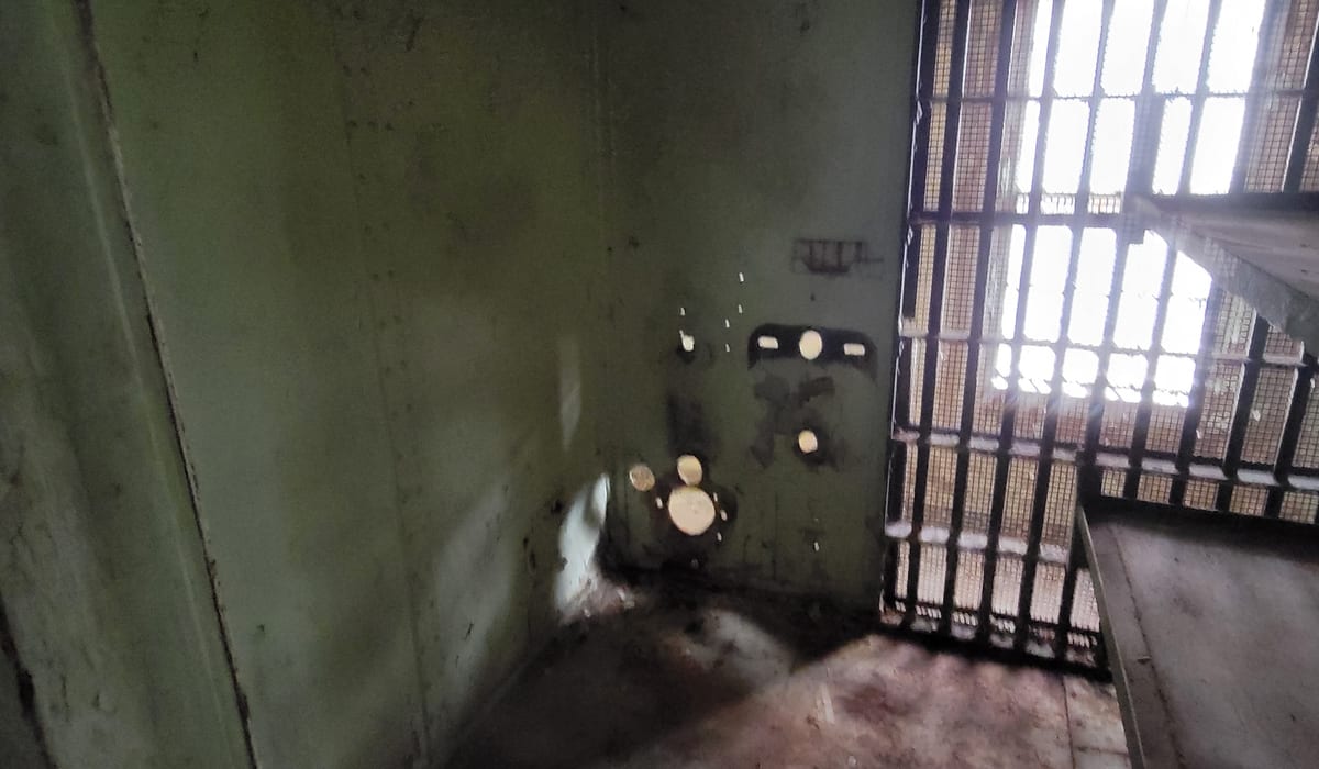 Historic jail cell block with iron bars