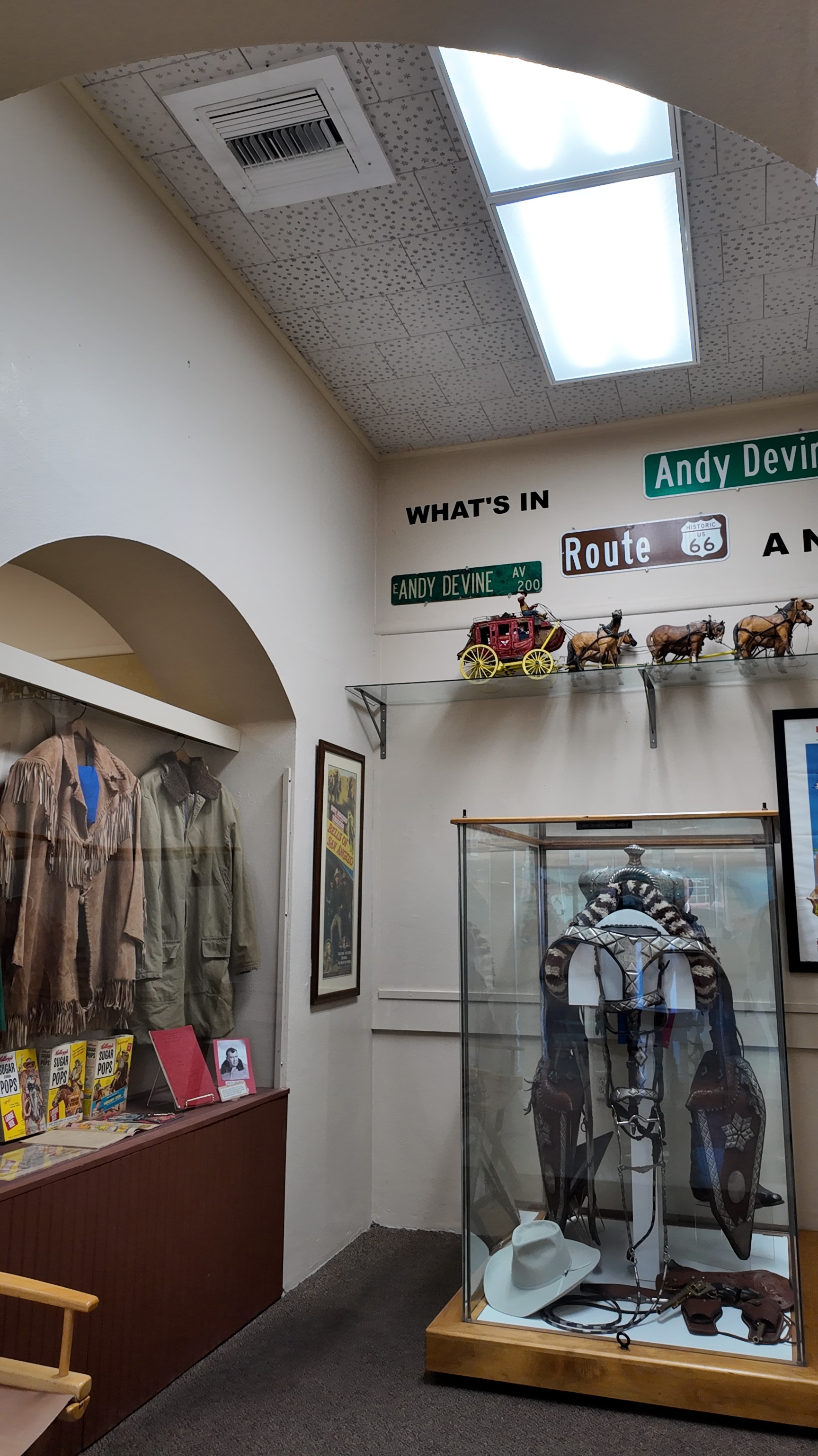 Western artifacts exhibit with Route 66 signage and saddles